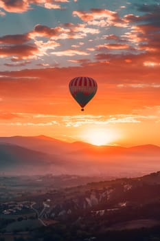 Hot air balloon flying at sunrise, scenic landscape with mountains and valleys.