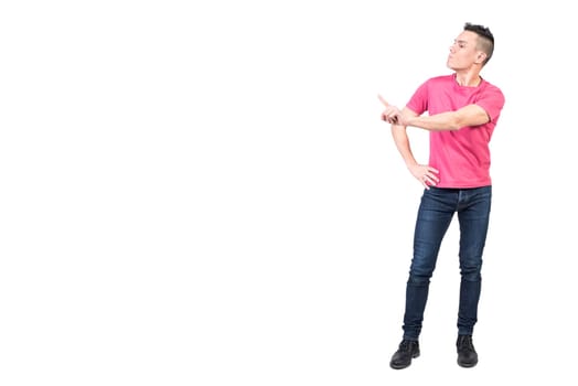 Full body of serious male model standing with hand on waist and showing reject gesture while scolding and expressing bad attitude on white background