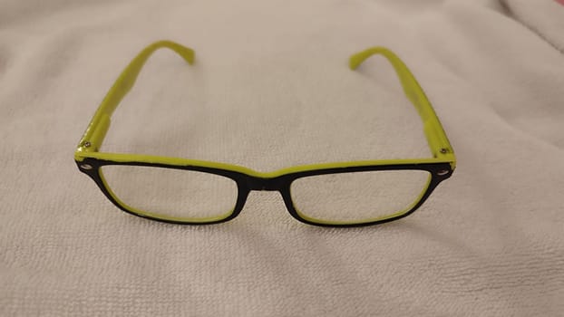 reading glasses, yellow black frame, object health medicine, ophthalmologist. High quality photo