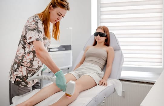 Master Conducts Laser Hair Removal Procedure For Client In Salon