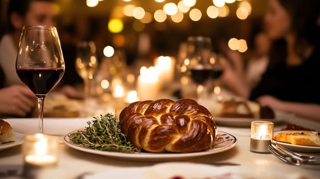 Family enjoying a festive dinner with challah bread and red wine in a warm atmosphere with candlelight