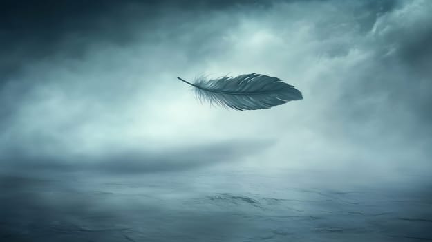 Single feather is floating over a misty landscape with dark clouds, creating a mysterious and atmospheric scene