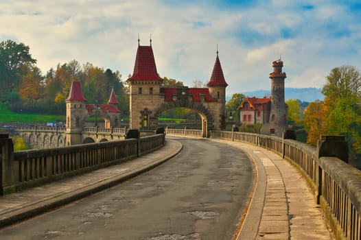 Beautiful old dam Les Kralovstvi - Czech Republic. Autumn background with colorful trees. Nature with landscape. Seasonal concept for fall.