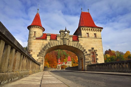 Beautiful old dam Les Kralovstvi - Czech Republic. Autumn background with colorful trees. Nature with landscape. Seasonal concept for fall.