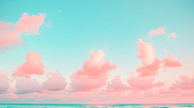 Cotton candy clouds are hovering in the sky above a turquoise ocean