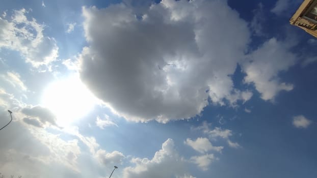 blue sky white clouds background nature air atmosphere weather, round sin light. High quality photo