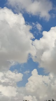 blue sky white clouds background nature air atmosphere weather, round sin light. High quality photo