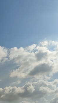blue sky white clouds background nature air atmosphere weather, round sin light. High quality photo