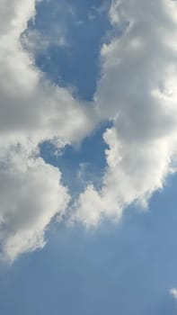 blue sky white clouds background nature air atmosphere weather, round sin light. High quality photo