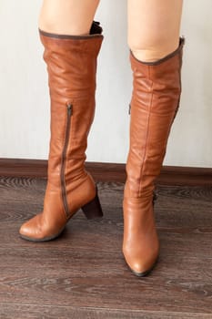Skinny woman wearing stylish leather tight boots