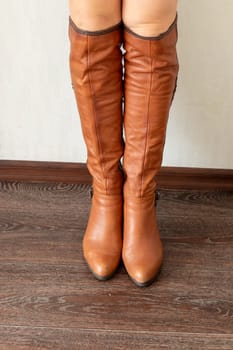 Skinny woman wearing stylish leather tight boots