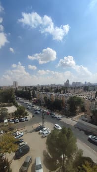November 3 2024 Beer-Sheva, Israel city day sky clouds, cars and building street landscape . High quality photo
