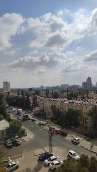 November 3 2024 Beer-Sheva, Israel city day sky clouds, cars and building street landscape . High quality photo