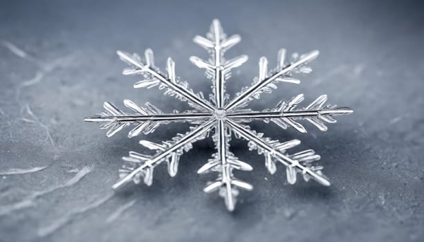 A stunning snowflake exhibits intricate patterns as it sparkles in the soft light of winter. The cool blue backdrop enhances its delicate beauty, capturing a serene moment.