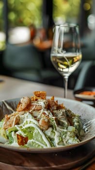 Delicious shrimp Caesar salad and white wine, set in modern cozy dining ambiance