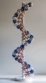 A model of a DNA molecule made from electric blue glass is displayed on a table. The intricate design resembles a body jewelry artifact