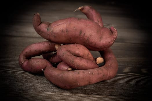 Sweet potatoes on the brown background, High quality photo