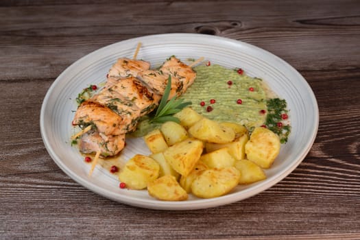 Barbecued salmon skewer with potatoes and broccoli Puree, High quality photo