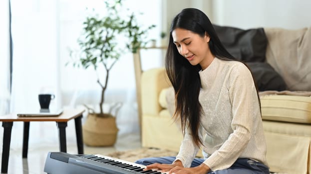 Pretty young woman enjoying a musical moment at home.