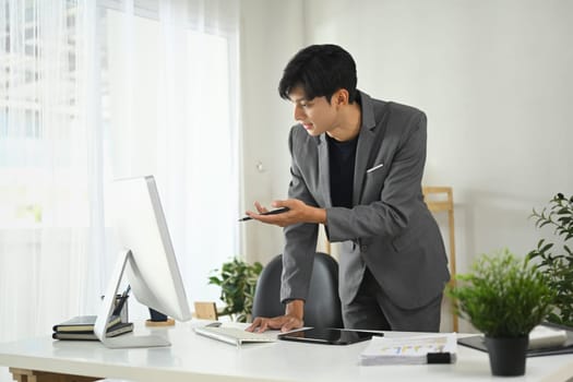 Businessman discussing strategy during a virtual meeting in the office.