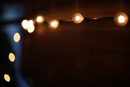 Festive backdrop fot your text or design. holiday illumination and decoration concept. Colorful defocused bokeh lights in blur night background. Defocused image