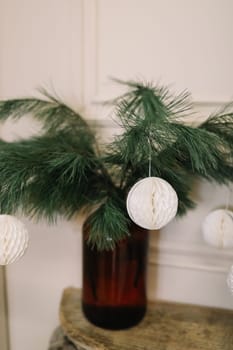 Christmas and New years eve Background. Close up of balls on christmas tree. Bokeh garlands in the background. New Year concept. Decorated Christmas tree on blurred, sparkling and fairy background