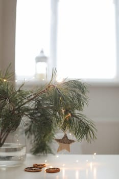 Christmas and New years eve Background. Close up of balls on christmas tree. Bokeh garlands in the background. New Year concept. Decorated Christmas tree on blurred, sparkling and fairy background