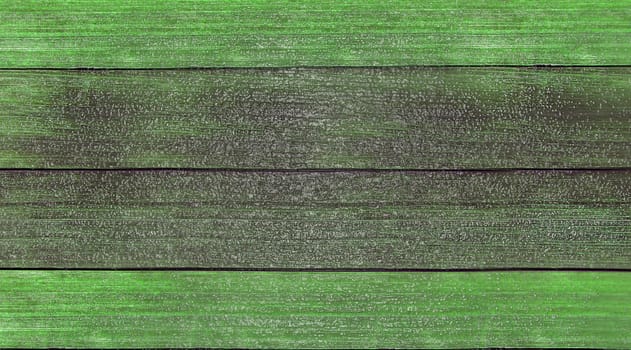 Wooden background. Old green painted wooden plank surface, aged weathered cracked boards. Grunge shabby texture, wallpaper, backdrop