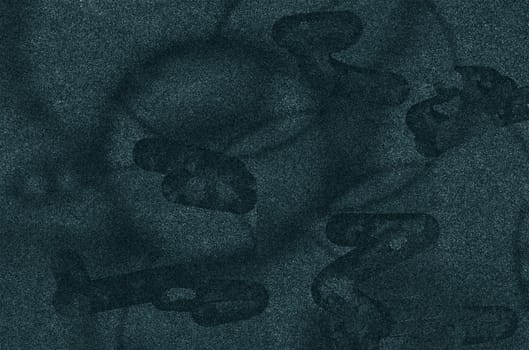 The background texture of a dark gray rough wall with an abstract pattern and spots