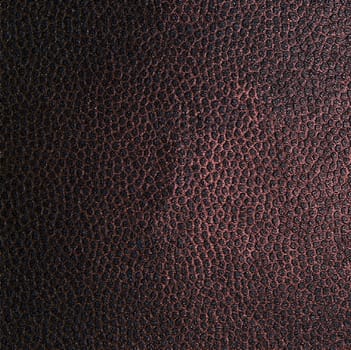 The structure of a dark brown fabric in the form of a dot pattern