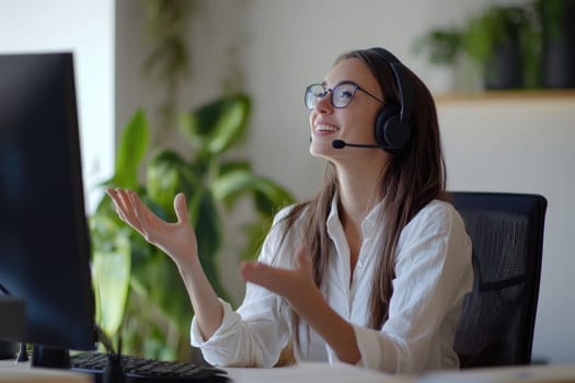 A cheerful agent uses sign language to communicate with clients, showcasing effective interaction in a modern call center environment.