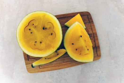 Delicious yellow watermelon sliced open to reveal its vibrant, sweet interior, perfect for summer