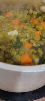 pea soup in a saucepan, lunch food dish, kitchen cooking. High quality photo