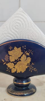 beautiful blue ceramic napkin holder, kitchen object , pattern autumn maple leaves ornament. High quality photo