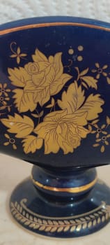 beautiful blue ceramic napkin holder, kitchen object , pattern autumn maple leaves ornament. High quality photo