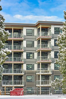 New low-rise residential building on finale stage of construction in winter season