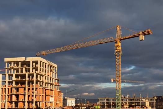 Construction boom in western Ukraine. An urban landscape showing cranes and buildings at various construction stages.