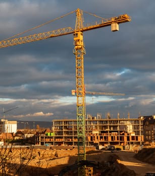 Construction boom in western Ukraine. An urban landscape showing cranes and buildings at various construction stages.