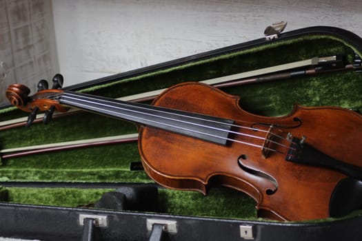 violin - an orchestral or solo professional bowed musical instrument with four strings. loved by children and adults. used in classical folk popular and jazz music. High quality photo