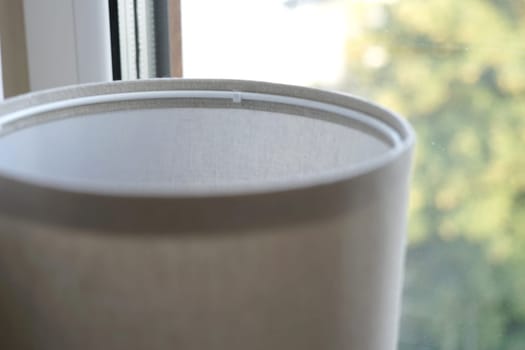 pastel beige bed lamp window curtains cozy home modern interior stay wait home look through window. High quality photo