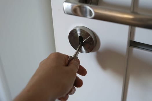 woman hand hold door handle open close secret security danger safety theft fraud keep steal . High quality photo