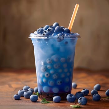 A cup filled with antioxidantrich blueberries and a drinking straw placed on a table, showcasing a healthy and refreshing superfood snack