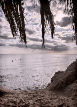 Comfortable beach on the beach with comfortable sun loungers and umbrellas.