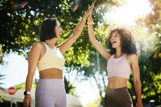 High five, yoga for fitness and woman friends outdoor together for success, support or motivation. Exercise, teamwork and partnership with young people in celebration as a winner for wellness.