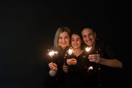 Family portrait on black background