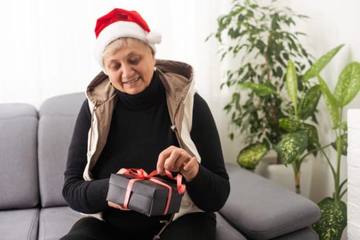 old woman holding a gift, Christmas.