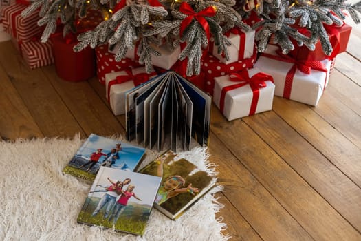 a photo album near the Christmas tree as a gift.