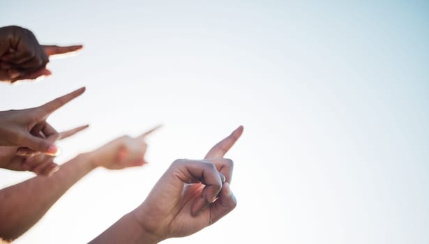 Fingers, closeup and pointing to sky mockup, collaboration and direction for climate change. Group of diverse hands, wellness, teamwork and solidarity for message in marketing, advertising or vision.