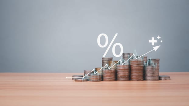 Coins are lined up on a wooden floor along with index charts, arrows and candlesticks. Represents financial, economic, business growth concepts. Financial success concept. Abstract finance background.