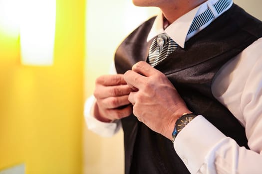 Professional man, fine gentleman, business executive fitting to their suit and preparing for daily office job, dressing to gentleman suit good for executive magazine or multimedia content creation